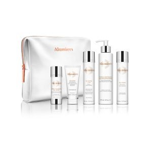 AlumierMD skincare set with bag.