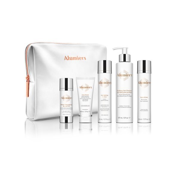 AlumierMD skincare set with bag.