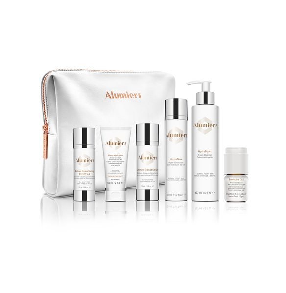 AlumierMD skincare products in a white bag.
