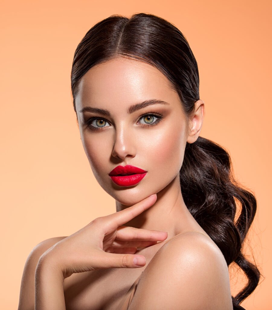 Woman with red lips and dark hair.