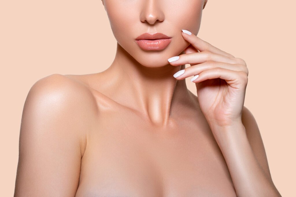 Closeup of woman's face and shoulder.